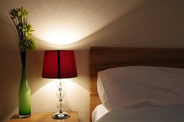 Bedside lamp in one of our rooms in the evening